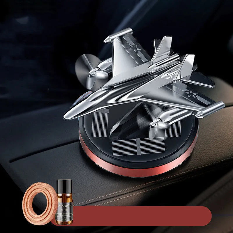 Solar-powered rotating perfume ornament in fighter jet design with aluminium alloy seat and essential oil bottle