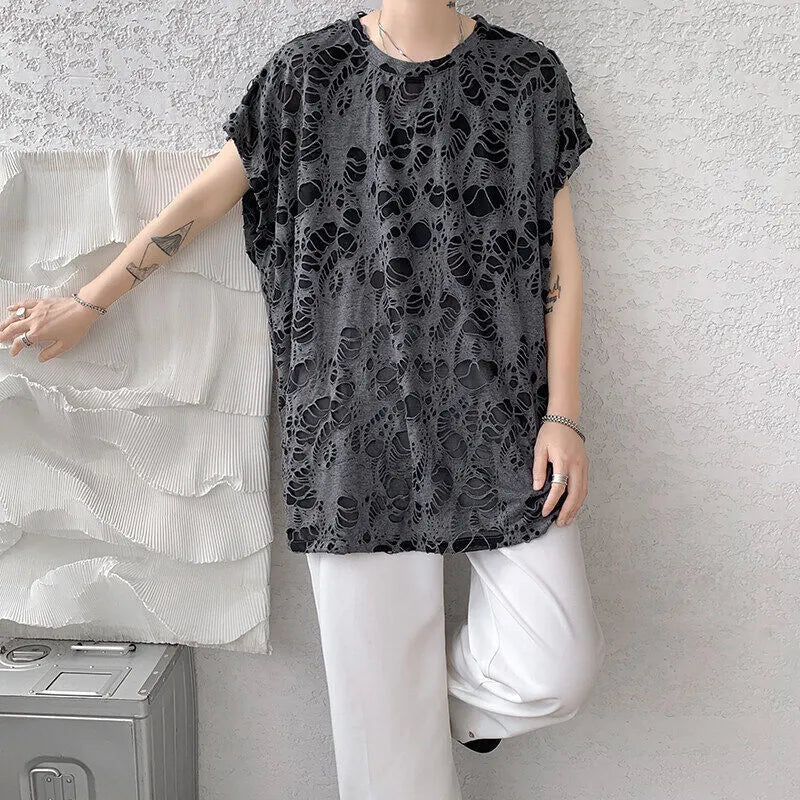 Black loose-fit sleeveless vest with ripped detail and wide shoulders, showcasing Japanese retro style.