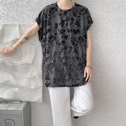 Black loose-fit sleeveless vest with ripped detail and wide shoulders, showcasing Japanese retro style.