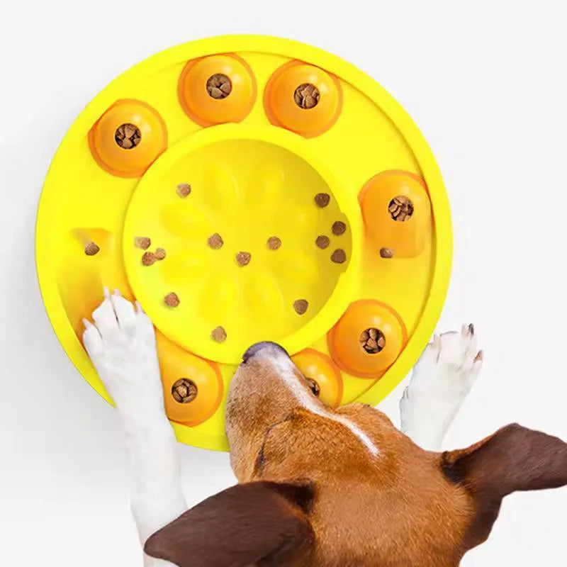 Square lake blue dog puzzle feeder with central column and rotating roulette top on a kitchen floor