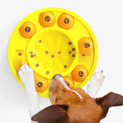Square lake blue dog puzzle feeder with central column and rotating roulette top on a kitchen floor