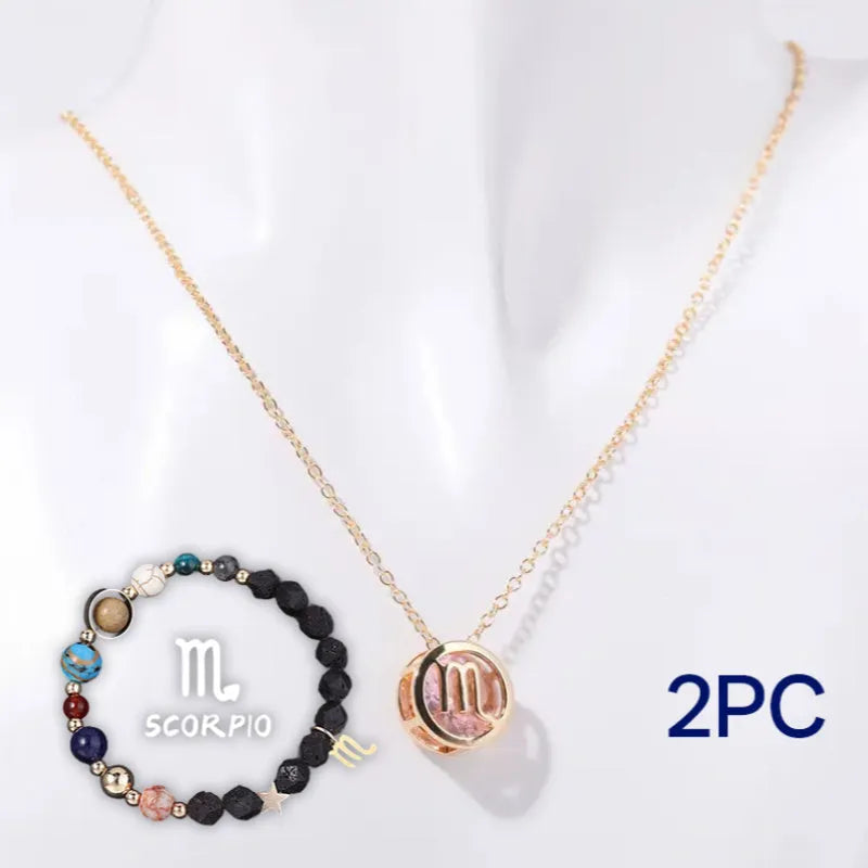 A natural stone beaded necklace and matching bracelet set laid flat, showcasing varied bead colours and textures.