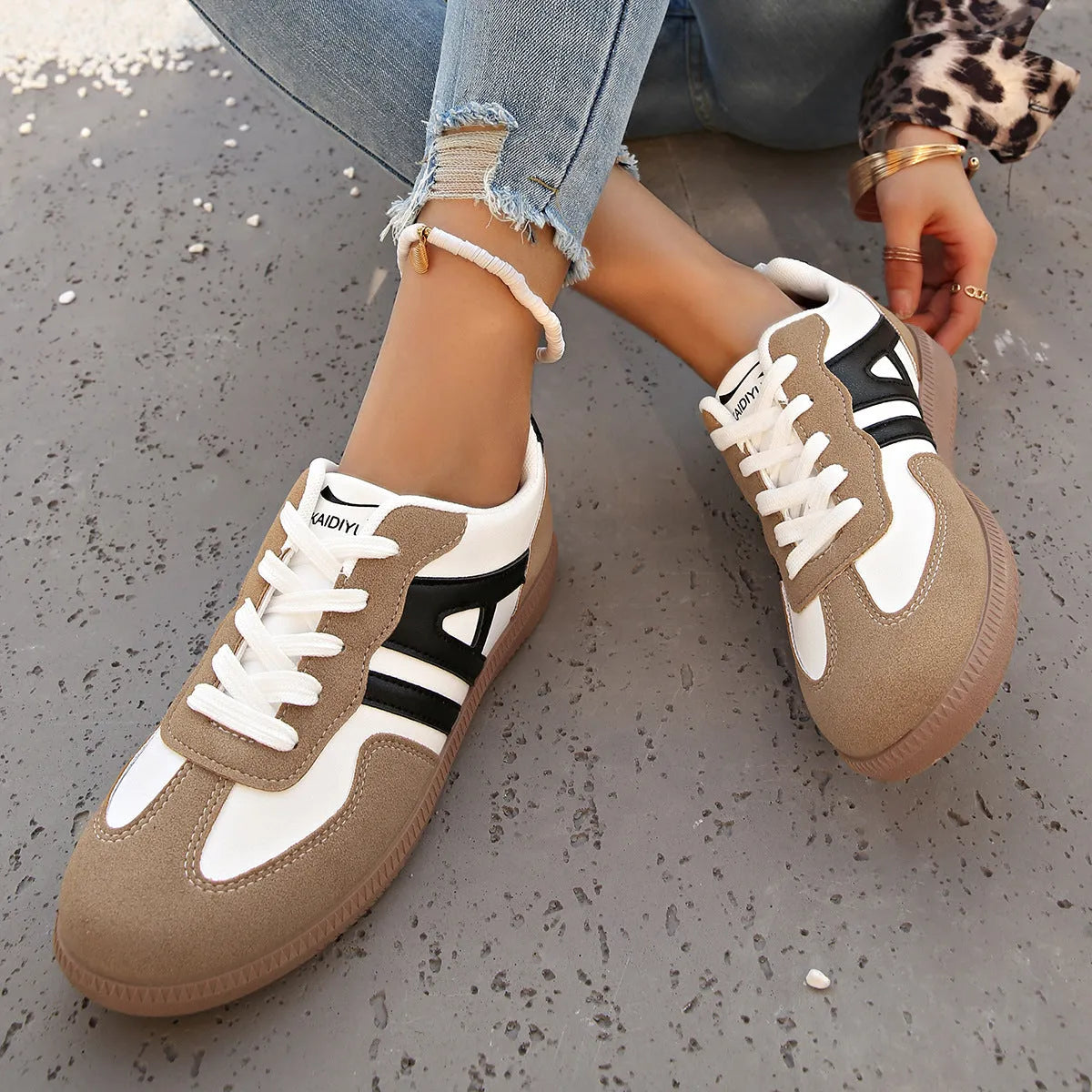 Women's retro lace-up jogging shoes in black, grey, and khaki with low platform heel.