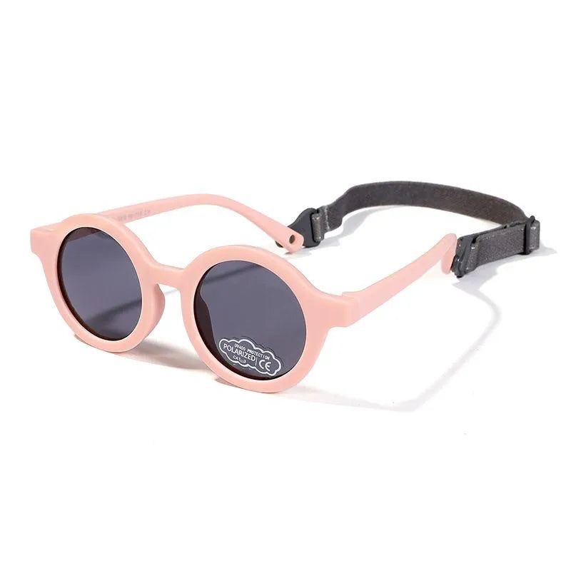 Children's round-frame polarised sunglasses with soft TPEE frame for ages 0-3, shown in assorted colours.
