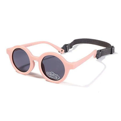 Children's round-frame polarised sunglasses with soft TPEE frame for ages 0-3, shown in assorted colours.