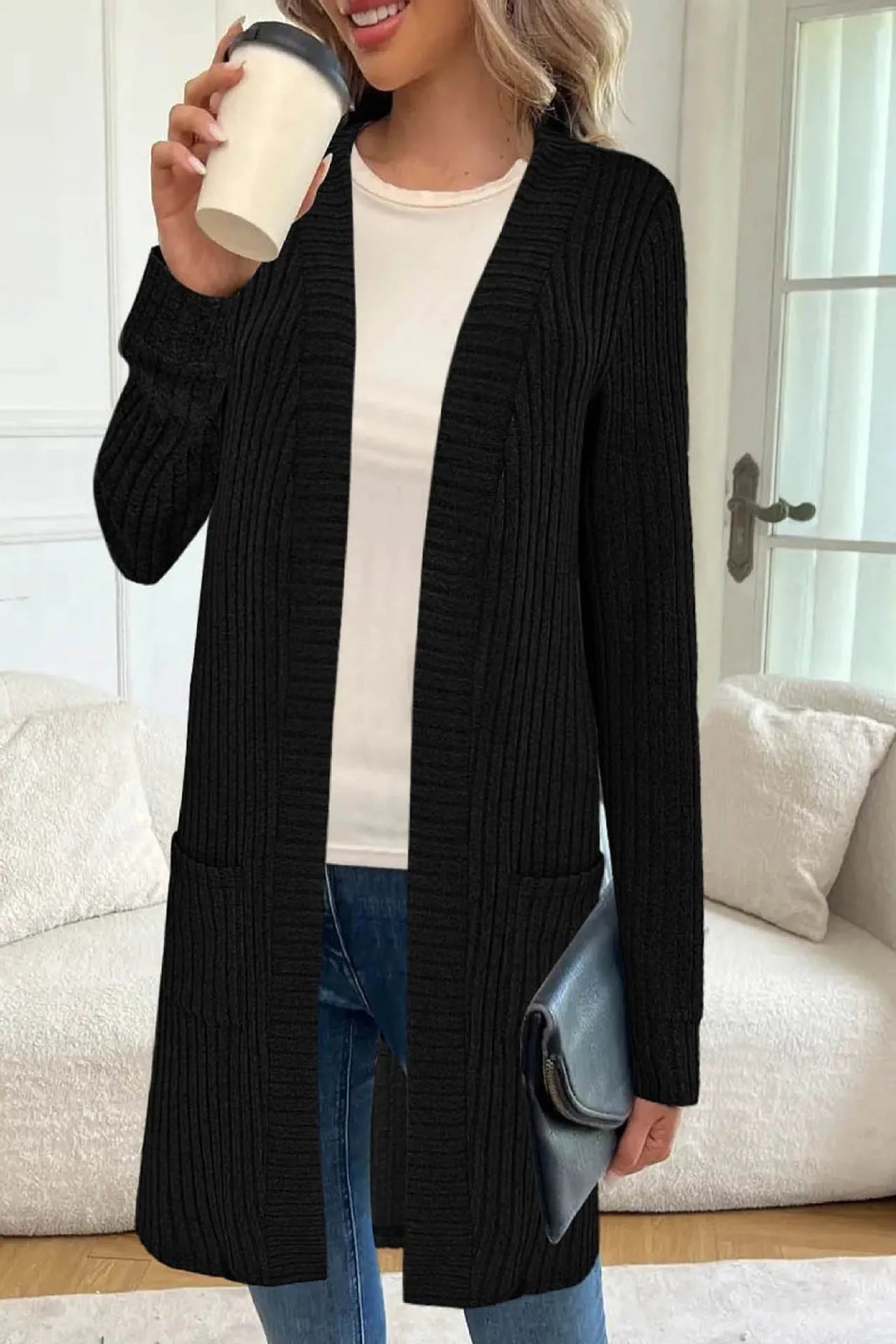 Long sleeve loose fit knitted cardigan jacket with side pockets, shown in grey.