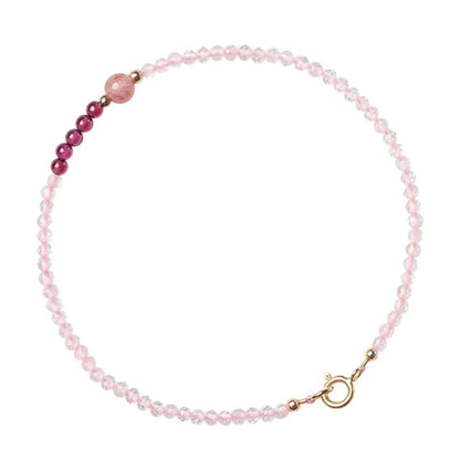Handmade pink crystal bracelet with strawberry quartz charm showing 2mm beads