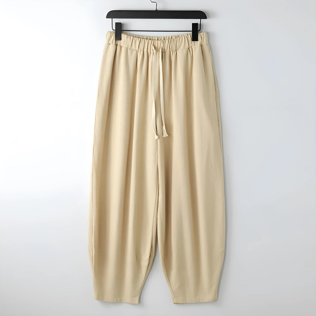 Loose linen harem pants with ankle ties in neutral colours for plus sizes