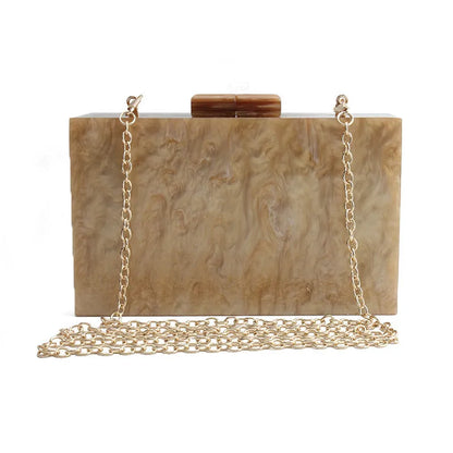 Small square acrylic clutch bag with long chain, marble pattern, and internal phone pocket