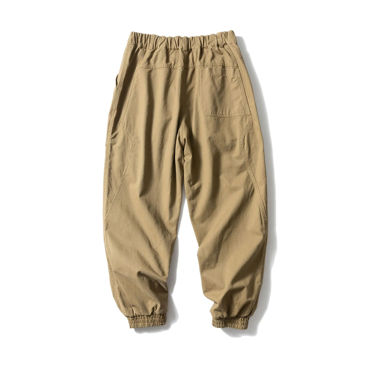 Solid colour cotton casual pants with large pockets and a tapered, ankle-tied silhouette.