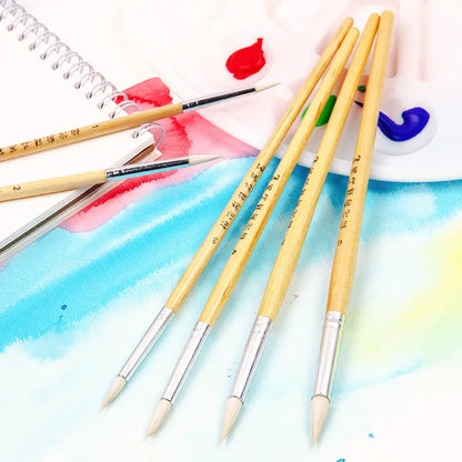 Six wooden-handled pen brushes with pointed wool bristles in conventional colours for artistic line work