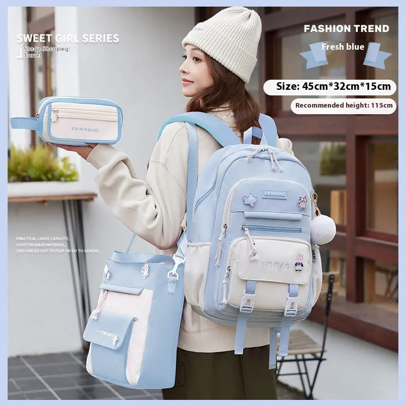 Pink waterproof Oxford cloth school backpack for girls with curved straps on a bookshelf.