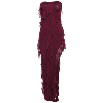 Stylish backless tube top dress with tassel accents in various colors, including black, wine red, red, and brown.