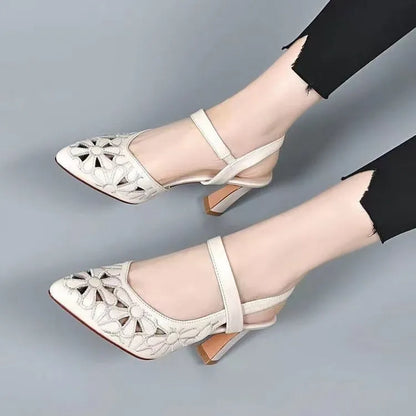 Red women's pointed toe backless sandals with a hollowed toe box and rubber sole