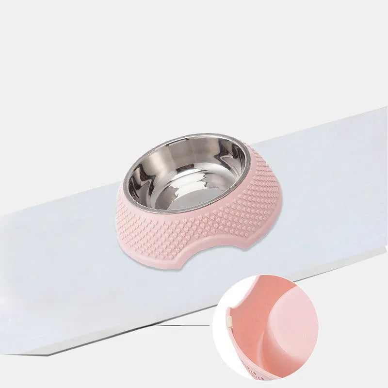 Set of four stainless steel pet bowls with non-slip bases in blue, green, and pink colours.