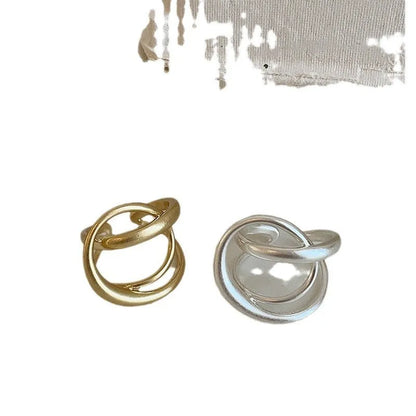 Three-dimensional interlaced geometric open ring in matte metal with real gold plating