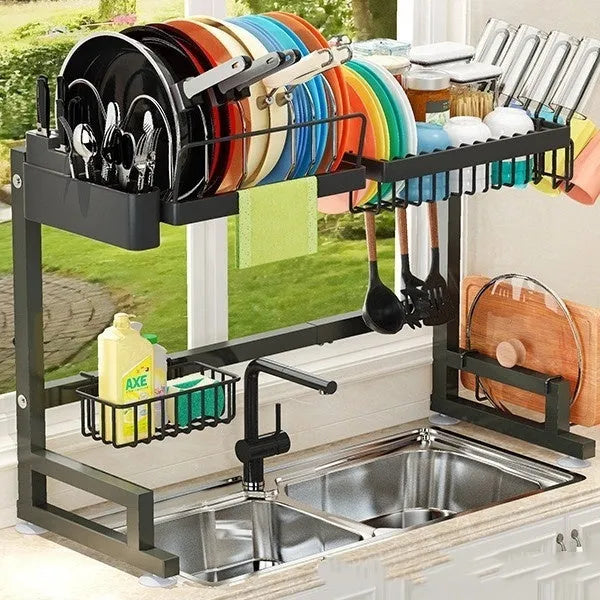 Black metal retractable sink draining rack extended on kitchen countertop