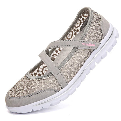 Women's beige lace-up casual flat shoes with a breathable mesh upper and round toe.