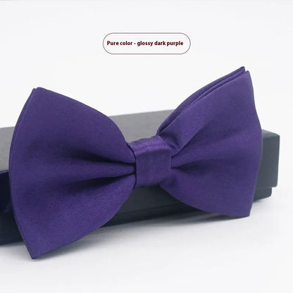 A solid colour pre-tied bow tie with an adjustable neck strap, shown in a classic flat head shape.