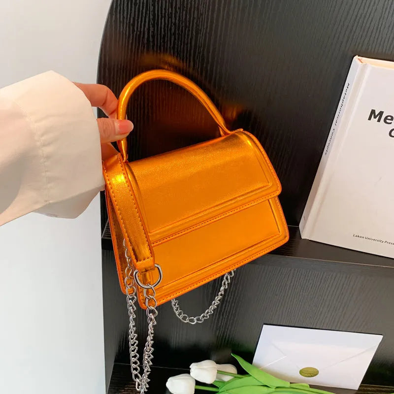 Retro horizontal square PU crossbody bag in multiple colours with sewn detail.