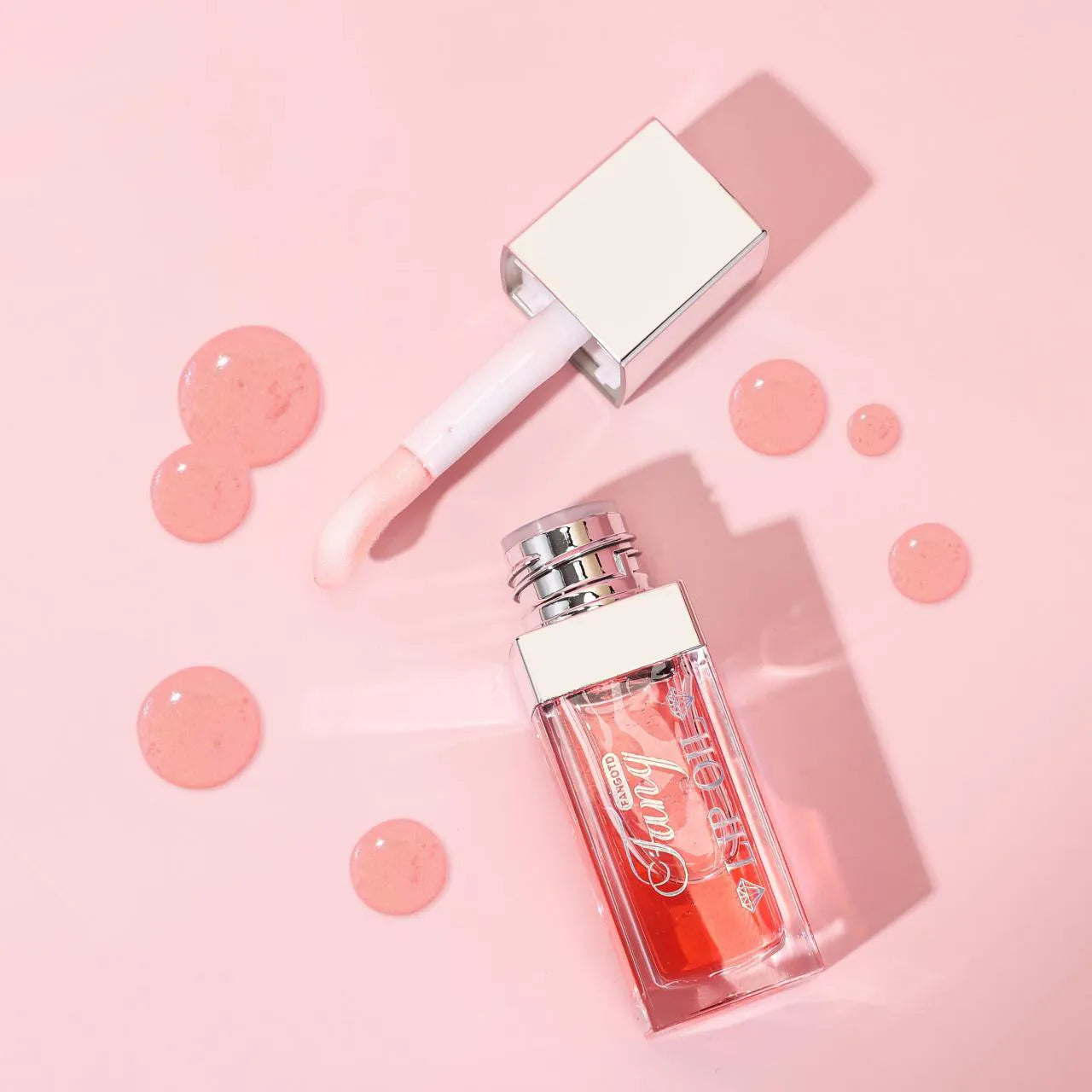 Set of five bright lip gloss tubes with lip essence oil applicators in shades Style001, 006, 007, 012, and 015.