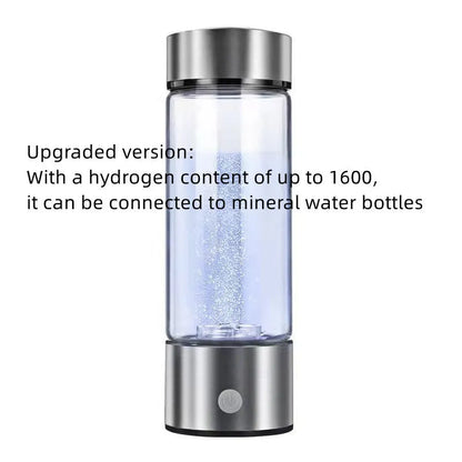 Portable hydrogen water bottle with glass chamber and stainless steel components showing electrolysis bubbles