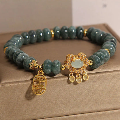 Women's natural emerald jade bracelet with abacus bead design and safety lock clasp