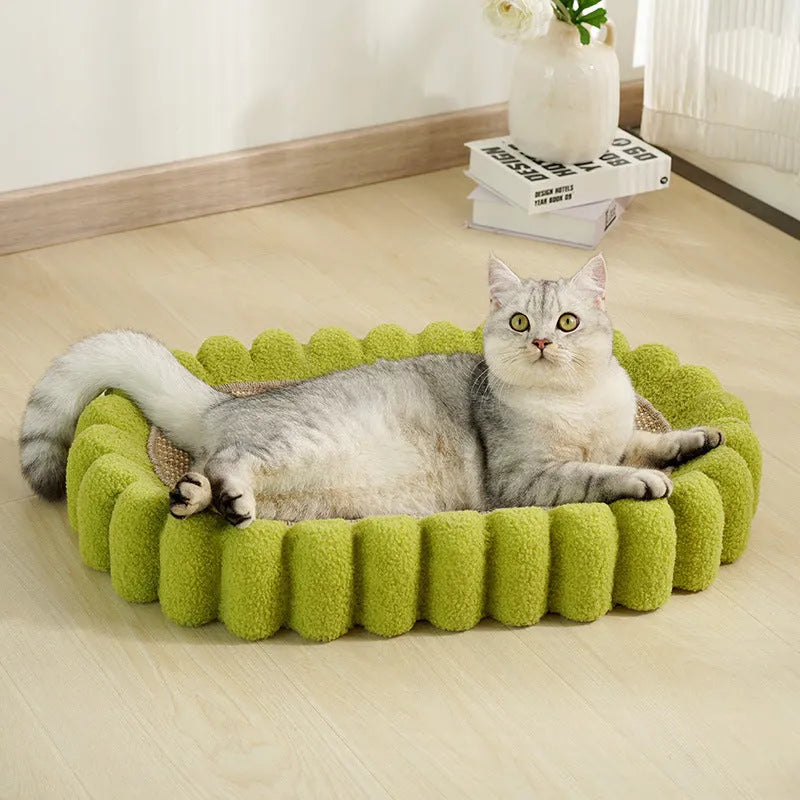 Green oval-shaped sisal cat scratching pad with a deep centre bowl for use as a cat bed.
