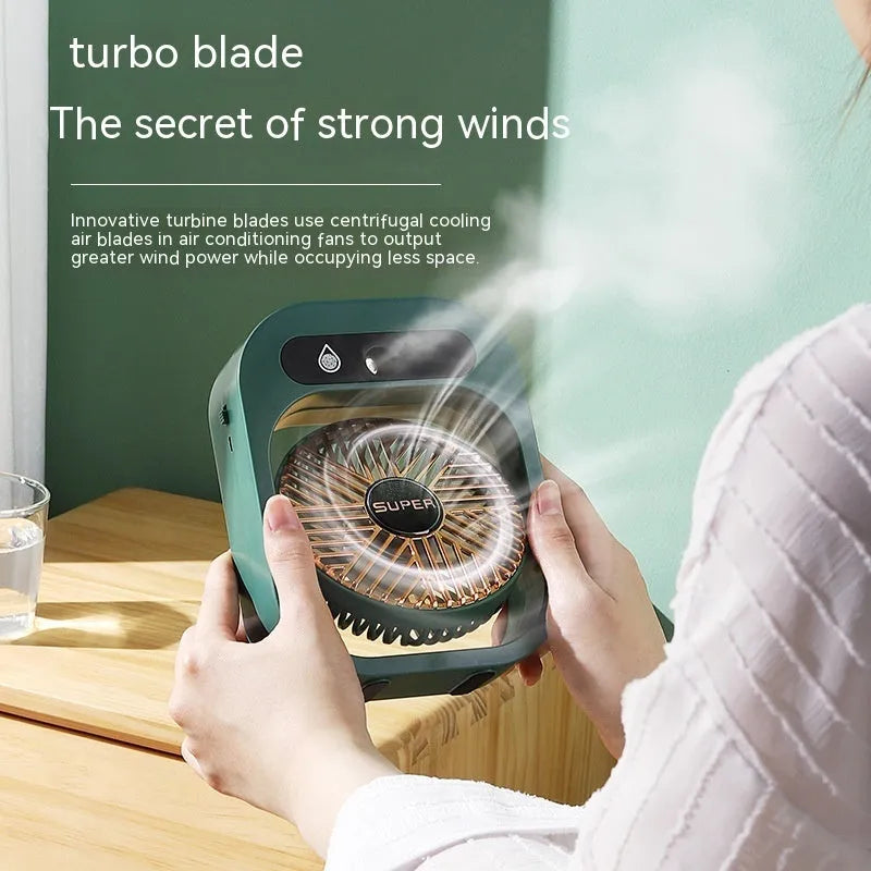 Green and white USB rechargeable misting fan humidifier with adjustable head on a desk