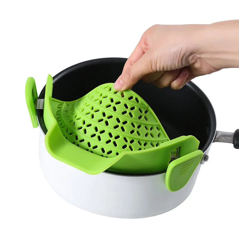 Silicone and stainless steel pot side drain stopper kitchen gadget in assorted colours.