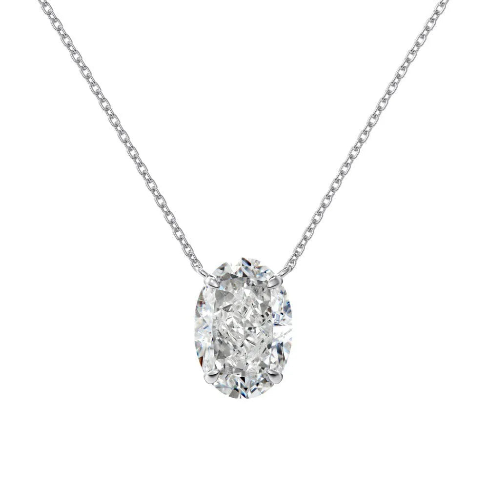 Close-up of a geometric oval ice flower pendant on a sterling silver necklace, showing gold or platinum finish.