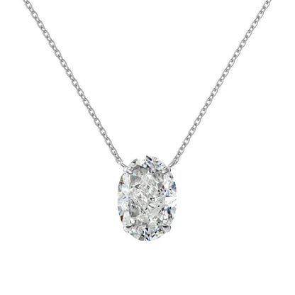 Close-up of a geometric oval ice flower pendant on a sterling silver necklace, showing gold or platinum finish.