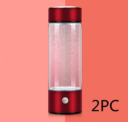 Portable hydrogen water bottle with glass chamber and stainless steel components showing electrolysis bubbles
