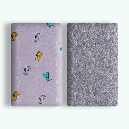 Double-sided cotton wool pet blanket in dinosaur print showing reversible construction
