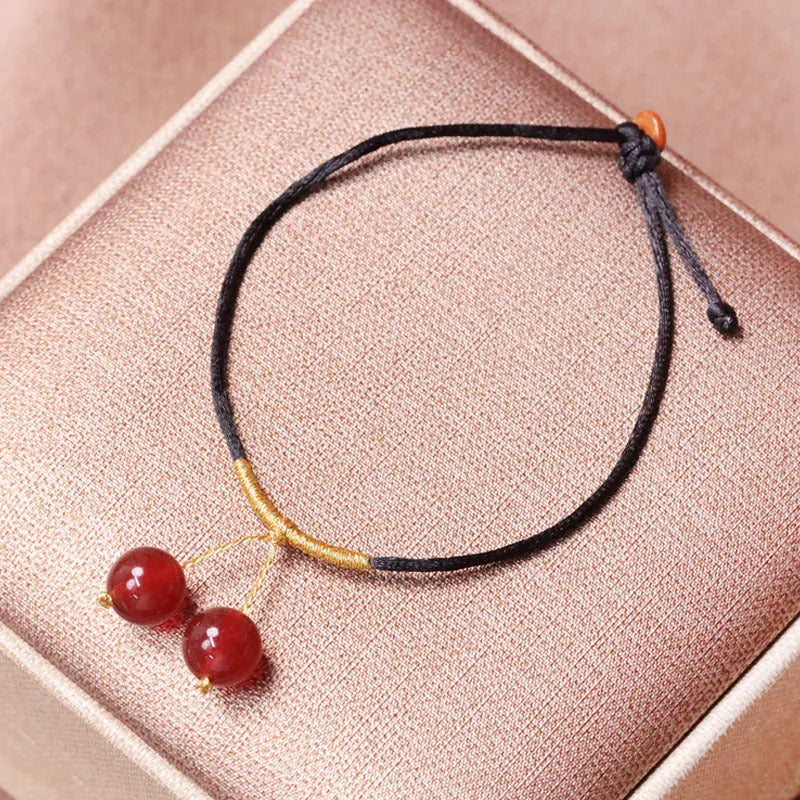 Hand-woven red agate bracelet and necklace set for women in national style with bead design.