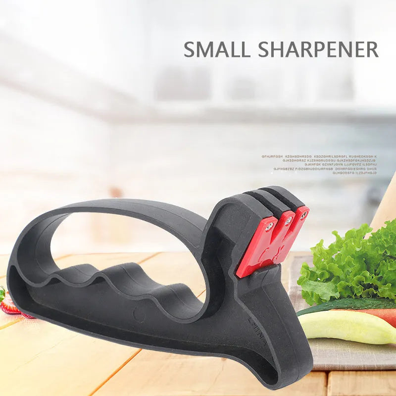 Black handheld ND-007 knife and scissor sharpener with ergonomic grip, showing ceramic and tungsten steel slots.