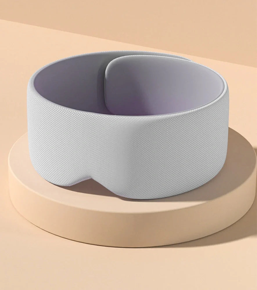 Double-sided sleep mask showing warm cotton and cooling ice silk surfaces with adjustable headband