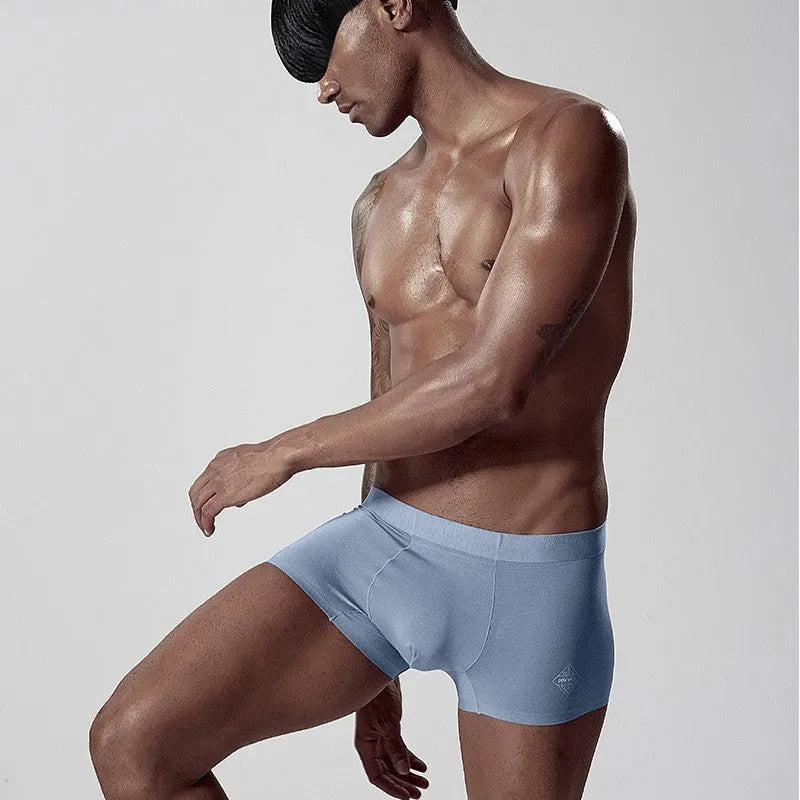 Men's solid colour seamless modal underwear in mid-waist style on a white background.