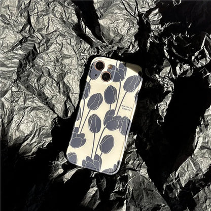 Black silicone iPhone case with a tulip floral pattern on the back.