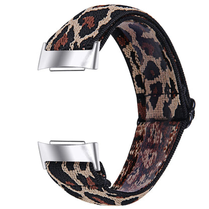 Printed elastic watch strap compatible with Fitbit Charge 6 shown in adjustable position