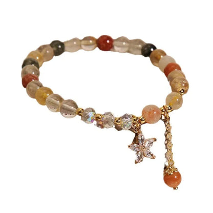 Colourful hair crystal stretch bracelet with cat's paw, butterfly, flower, and purse charms on adjustable band