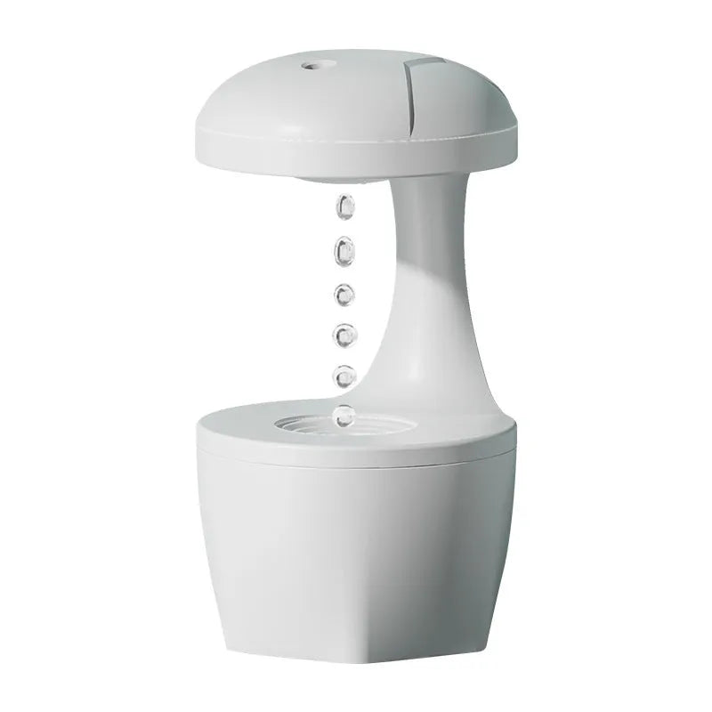 White, pink, and green column-shaped USB-powered ultrasonic humidifier.