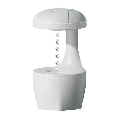 White, pink, and green column-shaped USB-powered ultrasonic humidifier.