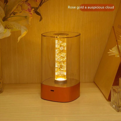 Elegant touch-controlled bedside lamp with soft, warm lighting, unique lamp post design, and wireless USB charging