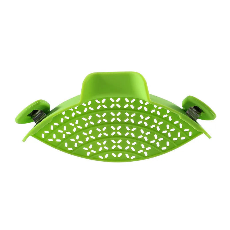 Silicone and stainless steel pot side drain stopper kitchen gadget in assorted colours.