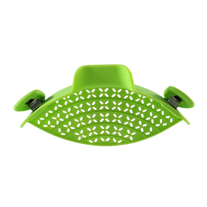 Silicone and stainless steel pot side drain stopper kitchen gadget in assorted colours.