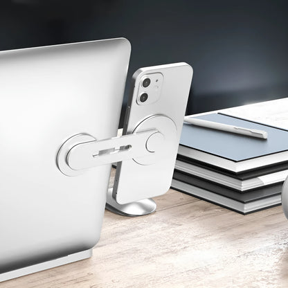 Silver aluminium alloy magnetic phone holder for Tesla vehicles showing 180-degree rotation mechanism