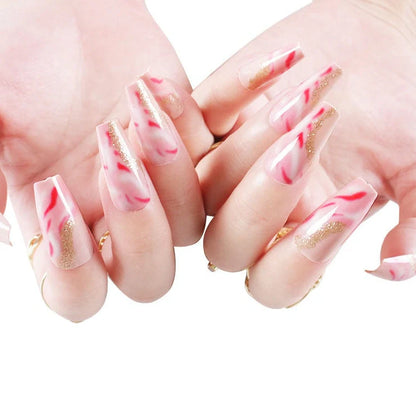 One Second Wearable Manicure set with 24 nail art pieces in rose, tulip, leopard print, and XINGX patterns