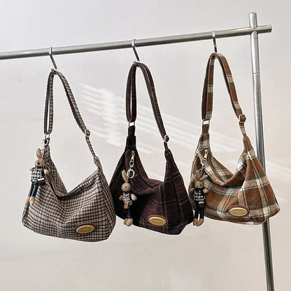 Women's large capacity woolen shoulder bag in brown with pendant attachment for autumn and winter use