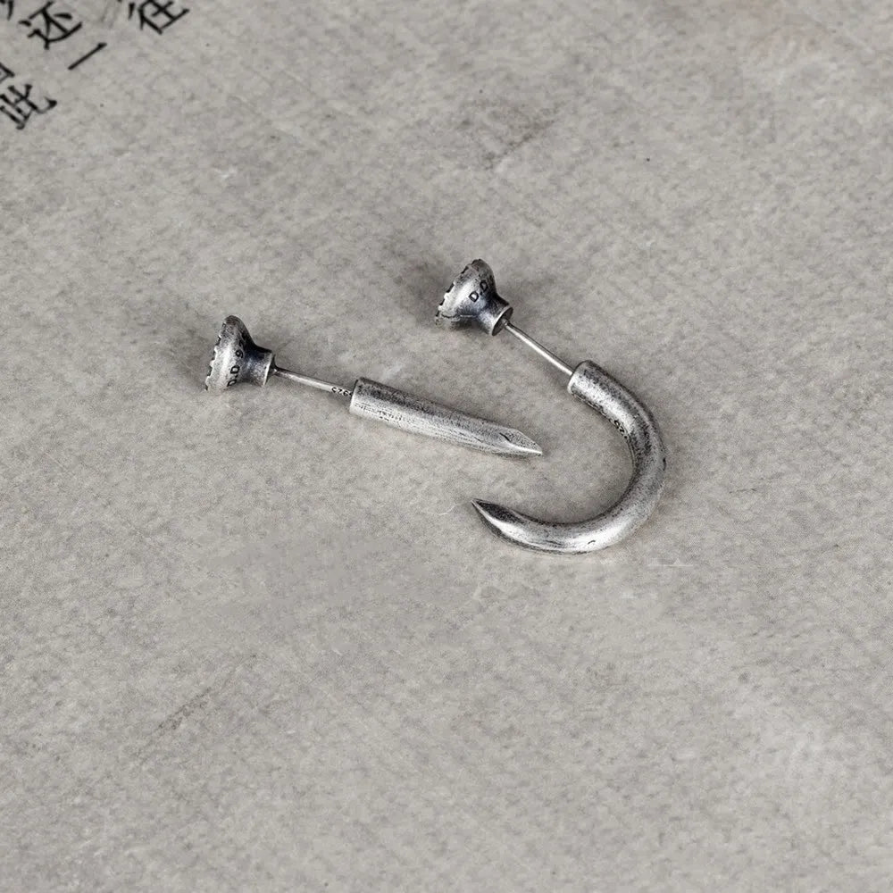 Sterling silver nail stud earrings showing straight and curved punk retro styles
